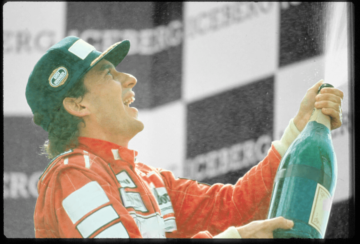 Ayrton Senna celebrating with champagne