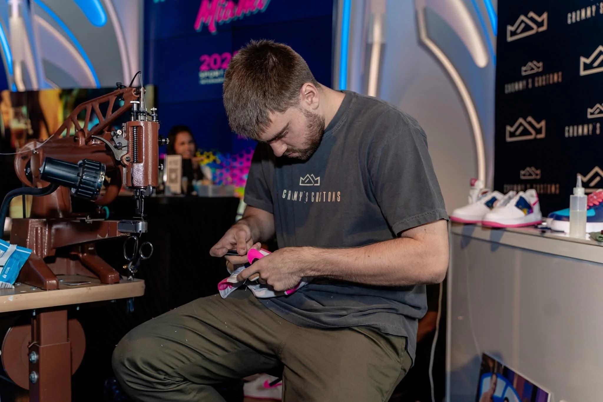 A Chummy’s artisan working on a custom shoe at a live event