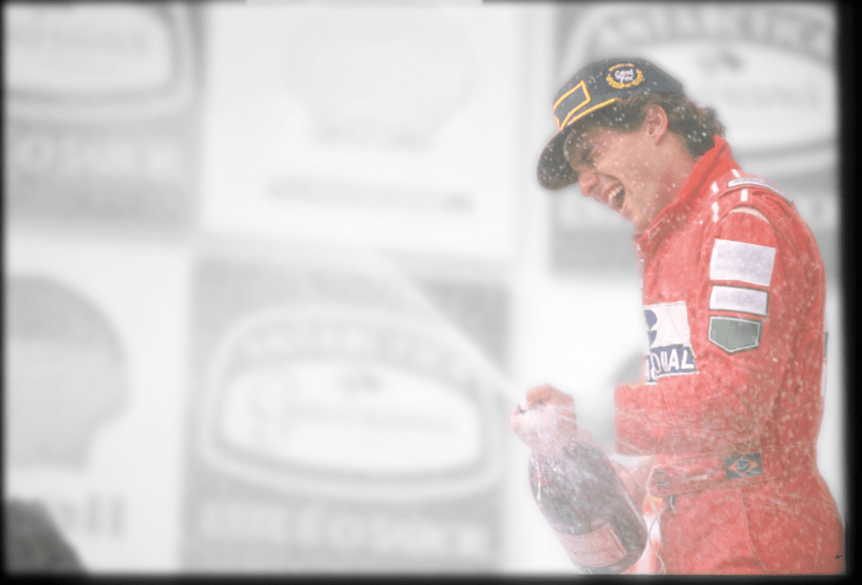 Ayrton Senna celebrating on the podium
